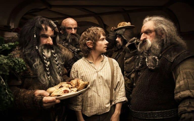 Martin Freeman surrounded by dwarfs in The Hobbit: An Unexpected Journey