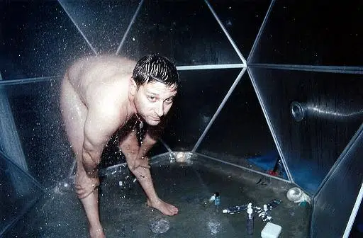 Josh Harris takes a shower in We Live in Public