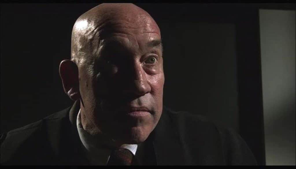 Simon Callow as a professor possessed by the spirit of Aleister Crowley