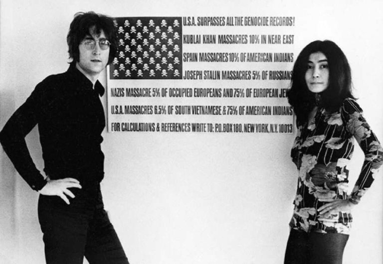 John Lennon and Yoko Ono in front of a version of the Stars and Stripes