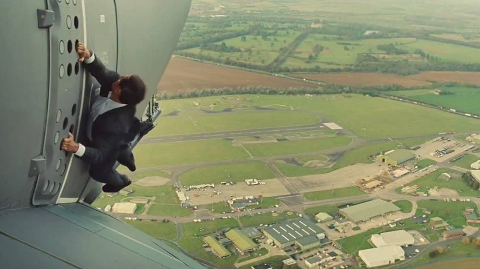 Tom Cruise hangs onto a cargo plane in Mission Impossible Rogue Nation