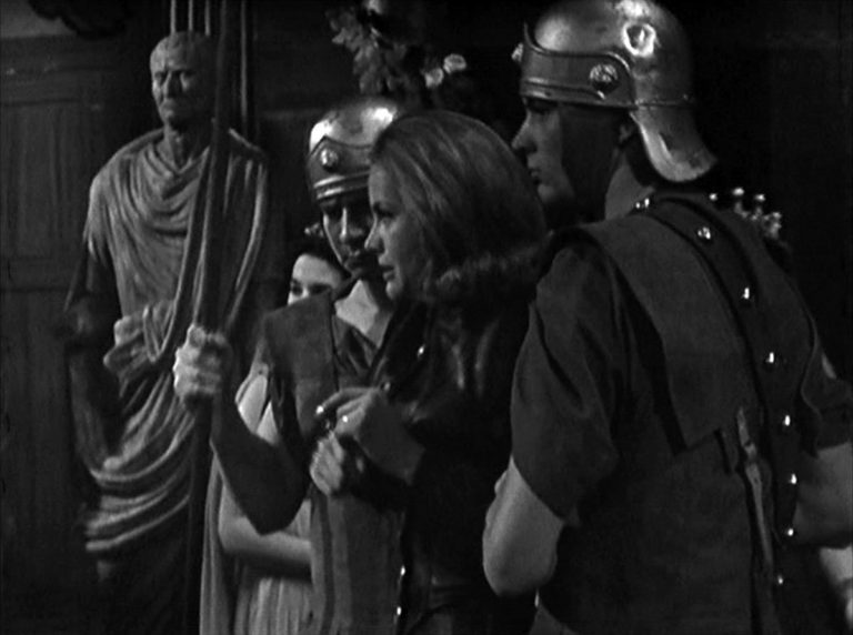 Mrs Gale is held by Roman soldiers