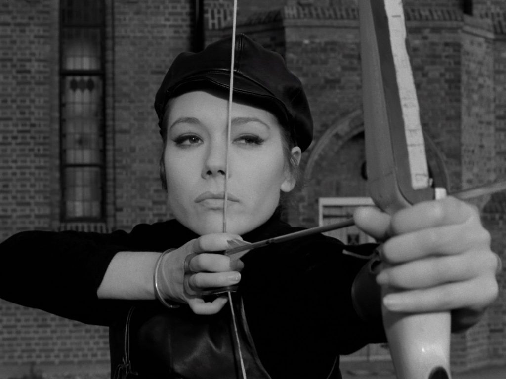 Emma Peel with bow and arrow