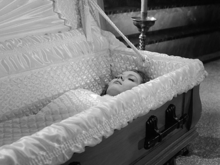 Emma Peel in a coffin