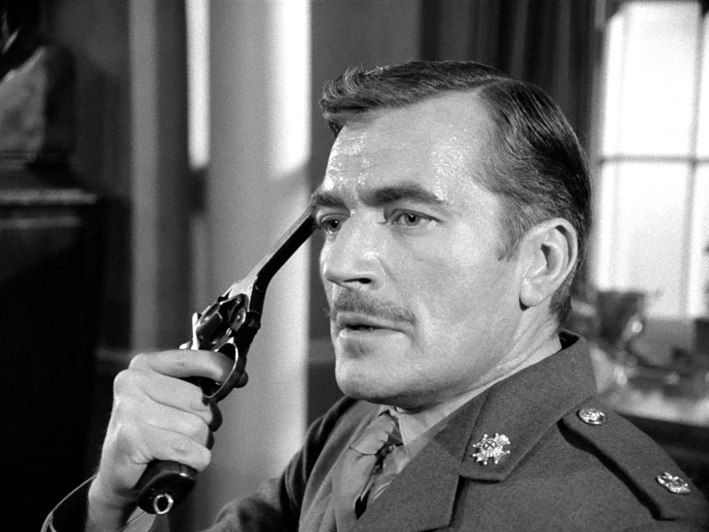 Nigel Davenport with a gun to his head