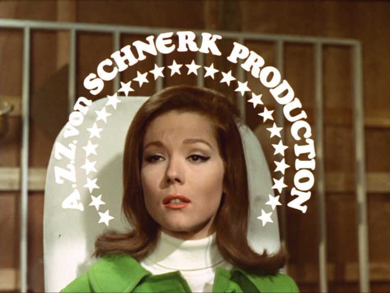 Mrs Peel surrounded by a halo reading a ZZ Schnerk Production