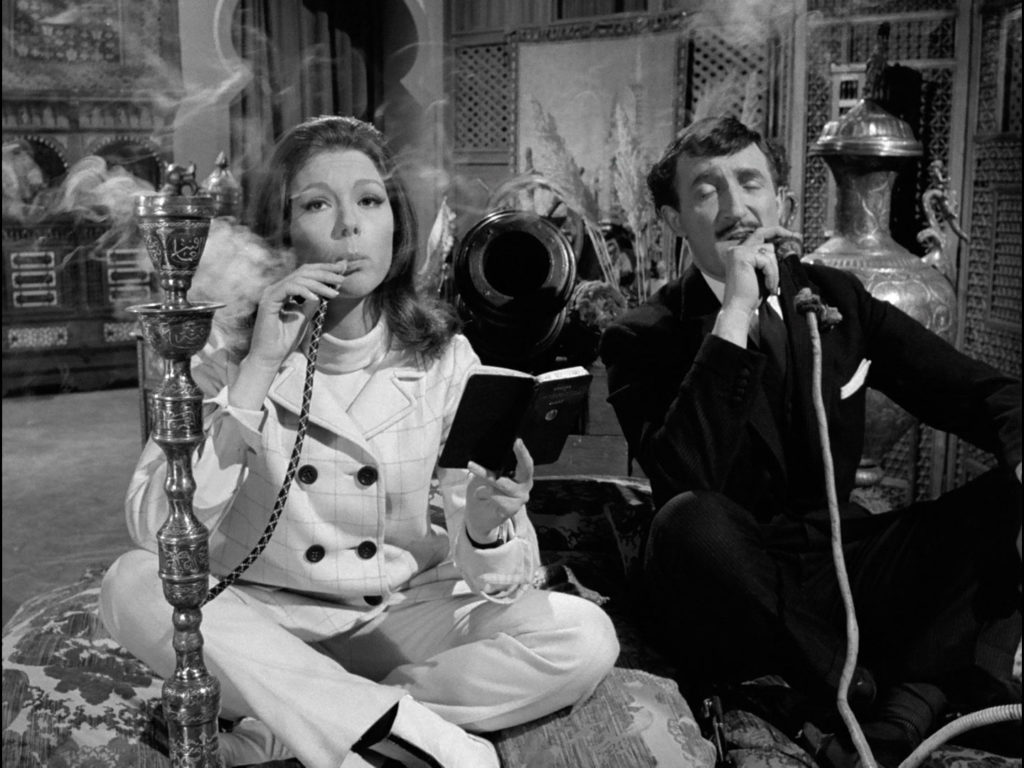 Diana Rigg and Ron Moody smoke a hookah