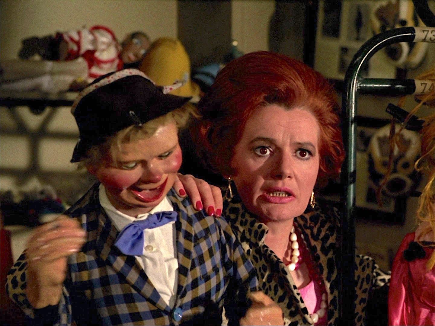 Pauline Delaney as Mrs Rhodes, with ventriloquist's dummy