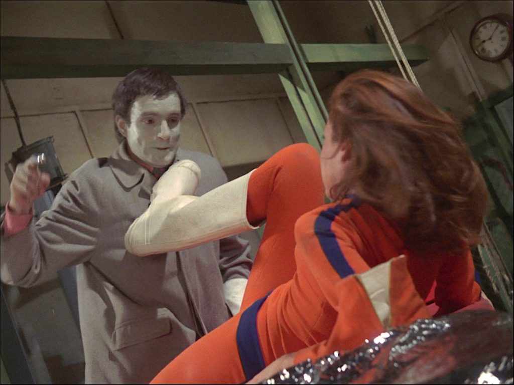 The creature attacks Emma Peel
