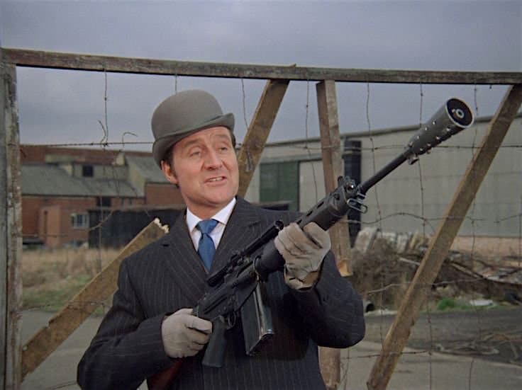 John Steed with automatic weapon