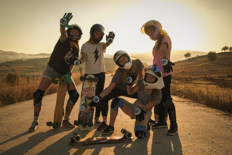 The five skateboarders in a group shot