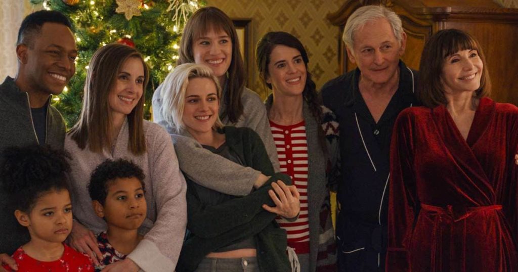 The family (plus guest) line up for a Christmas photo