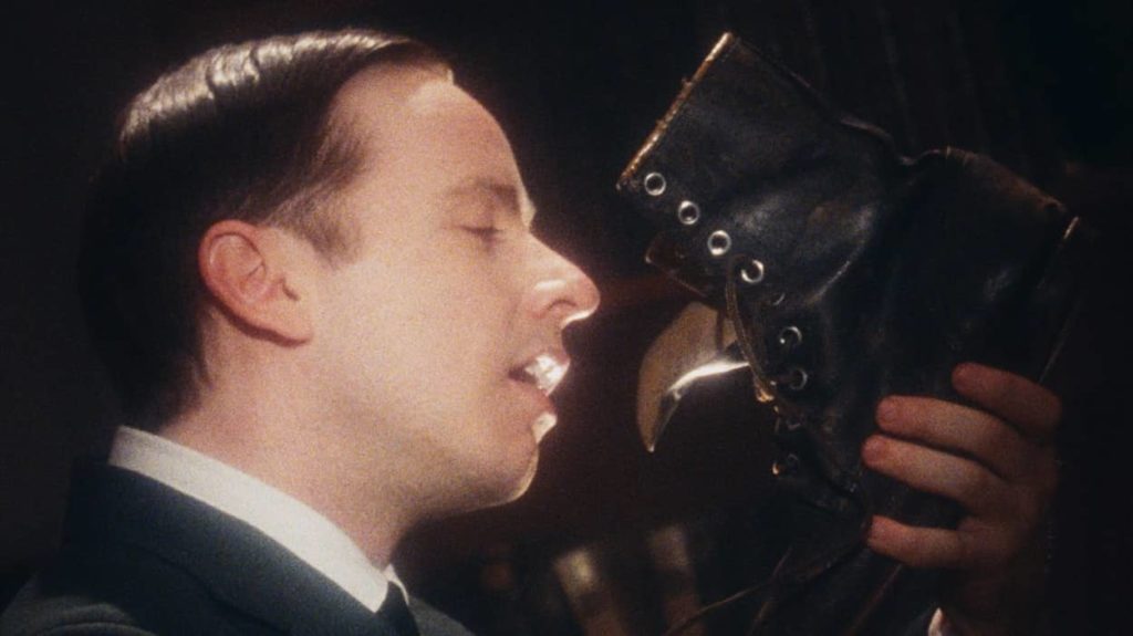 WL Mackenzie King sniffs a boot