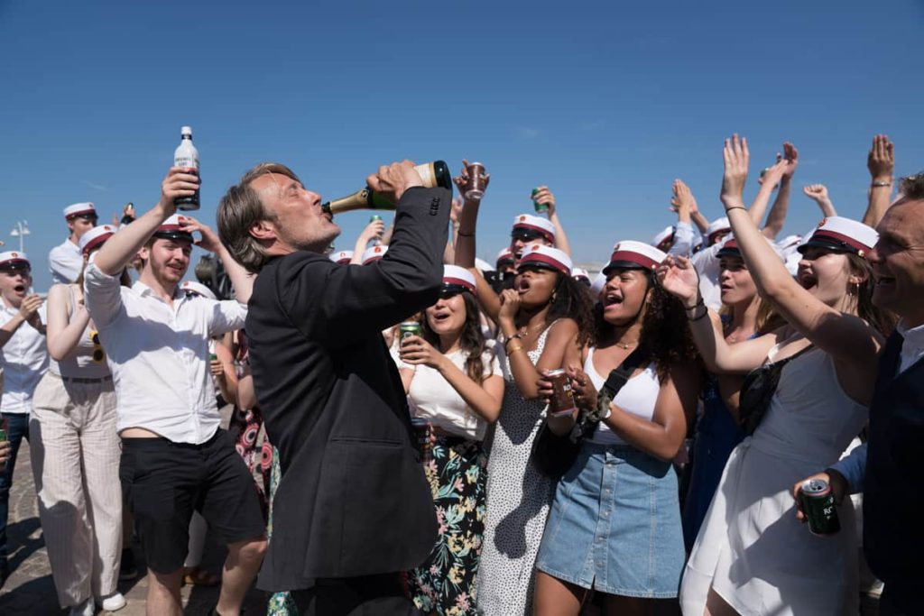 Martin chugs down a beer