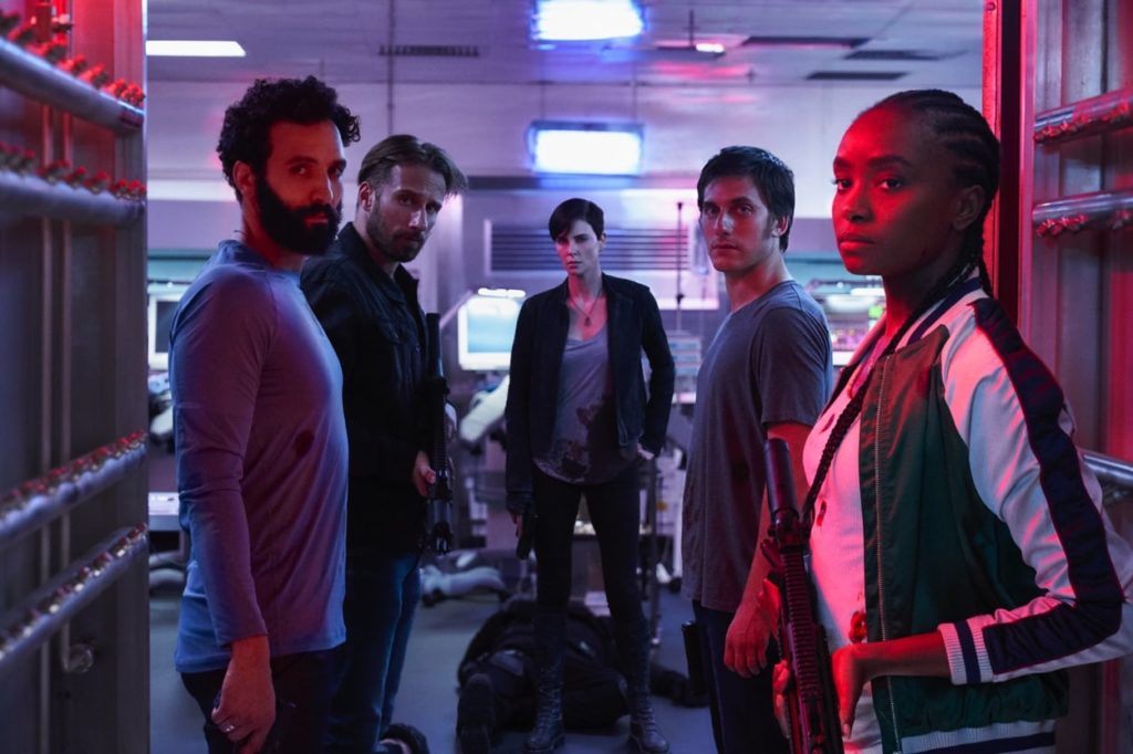 The cast of The Old Guard in a group shot