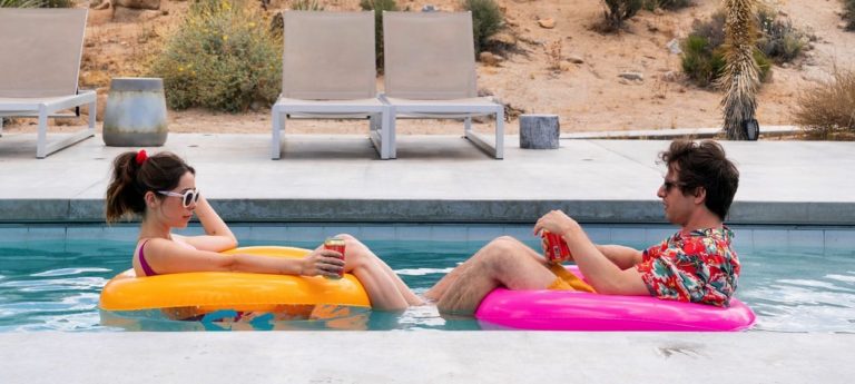Cristin Milioti and Andy Samberg floating in a pool