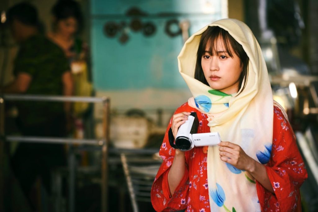 Yoko with a portable camera