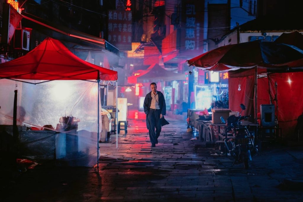 Luo walks the city streets