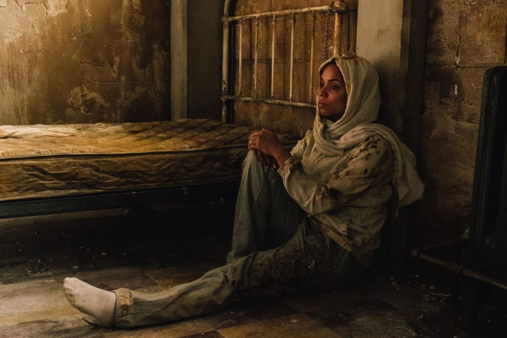 Khadija sitting in a cell