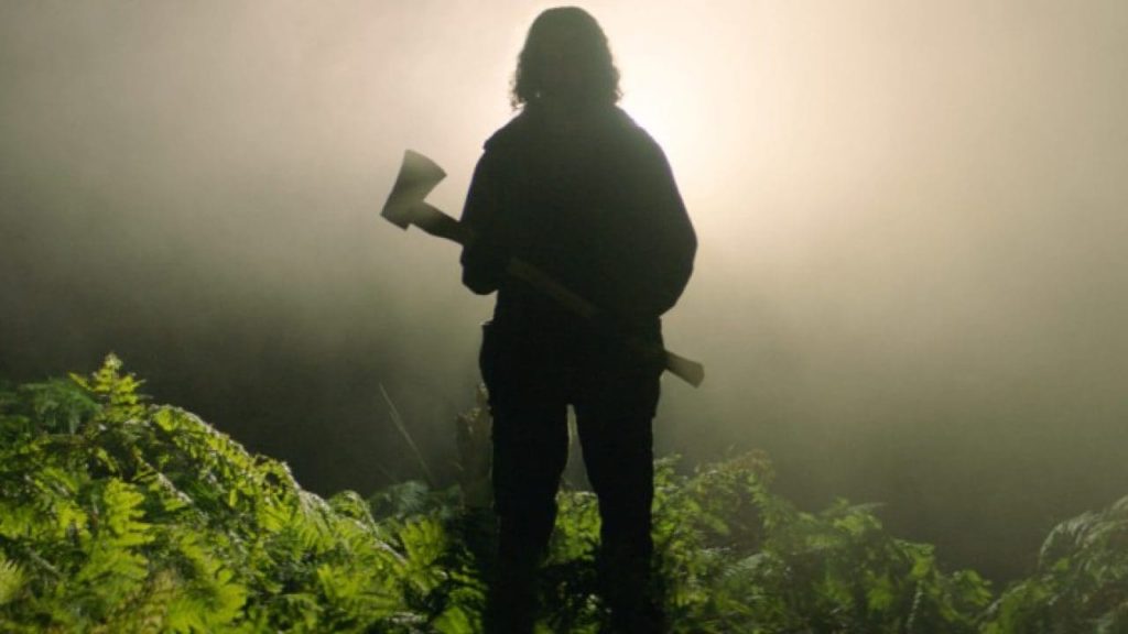 A shadowy man with an axe