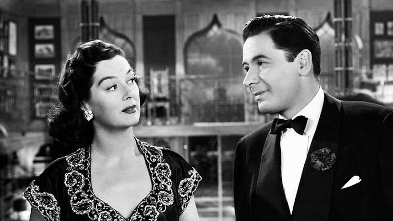 Rosalind Russell and Leo Genn