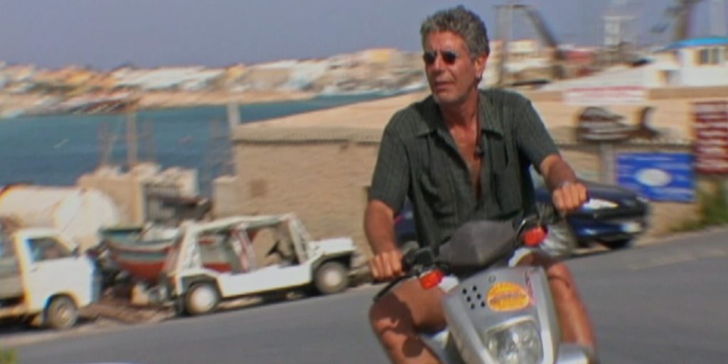 Anthony Bourdain on a scooter