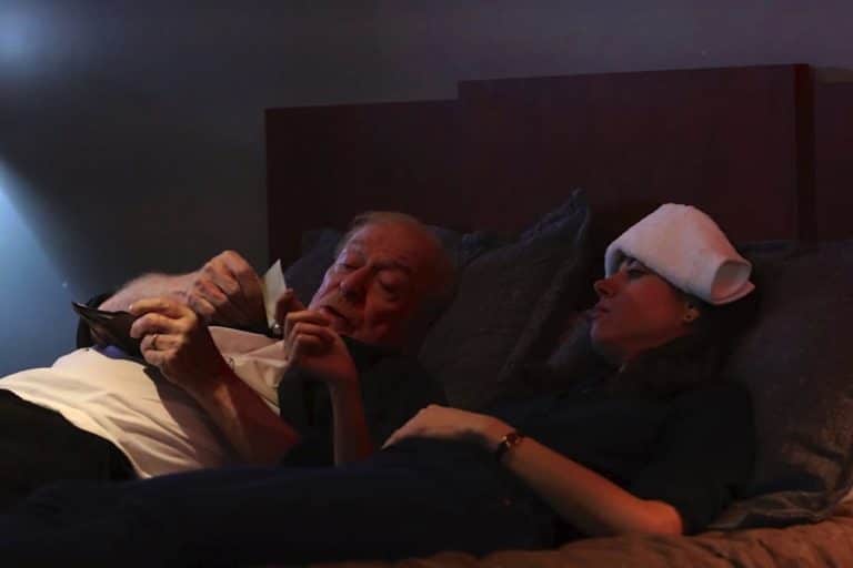 Michael Caine and Aubrey Plaza in bed