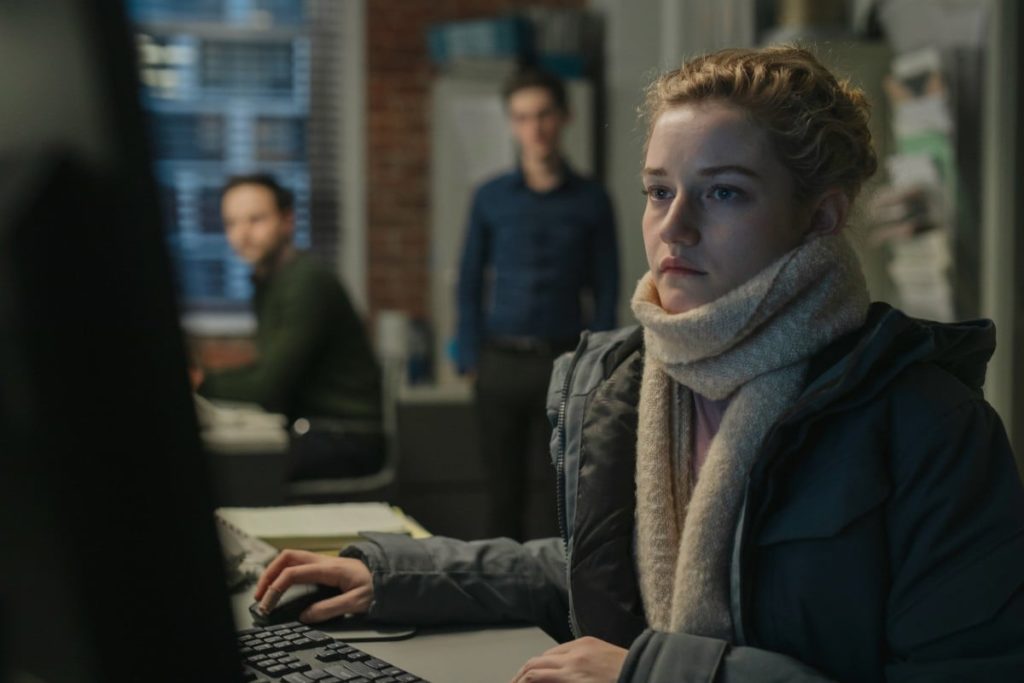 Jane, the assistant, with two men in the background