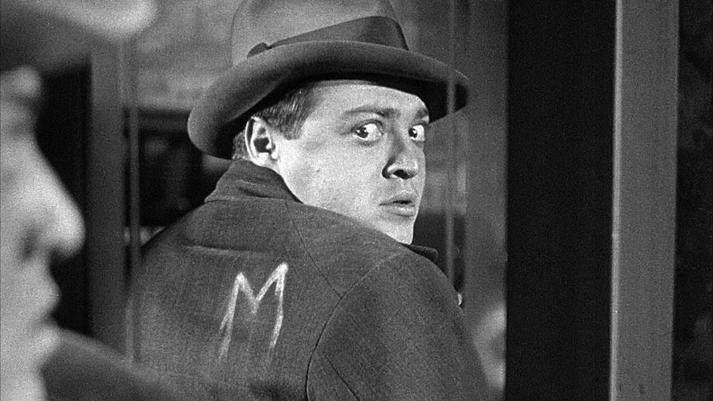 Peter Lorre with M chalked on his back