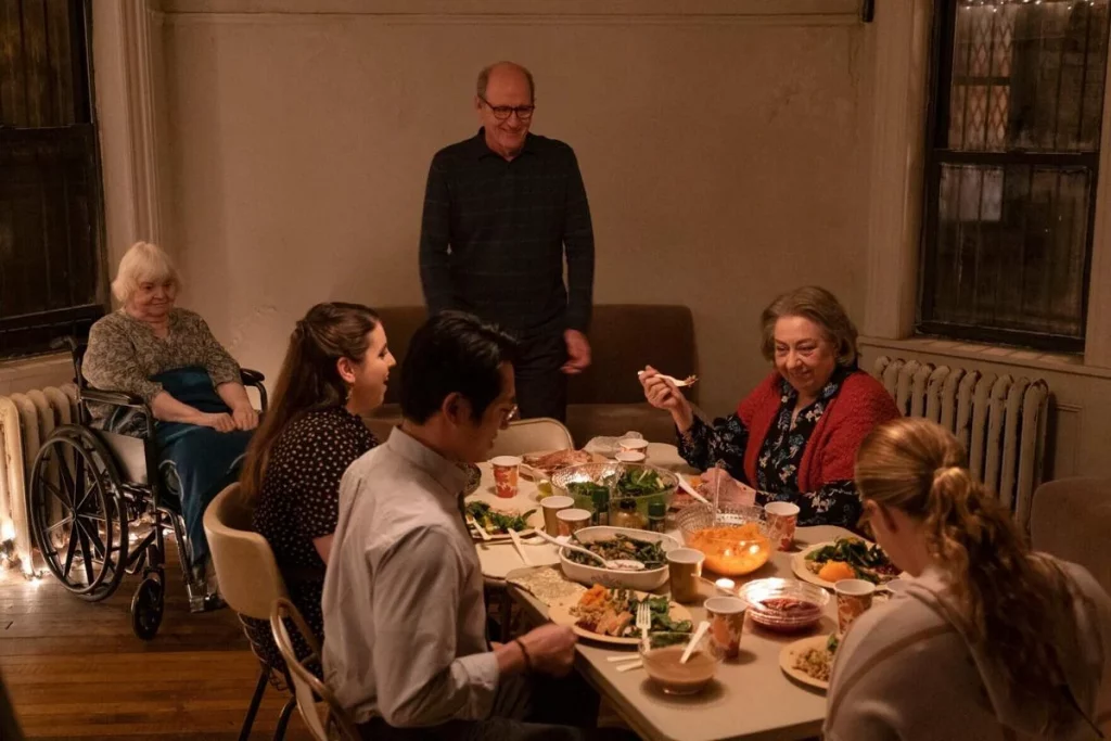 The family sit down to dinner
