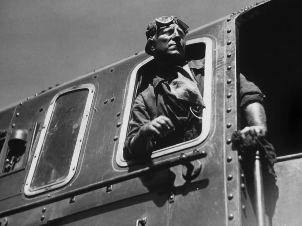 Lantier at the controls of his train