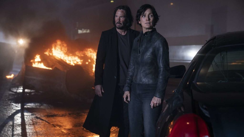 Neo and Trinity amid smoking rubble