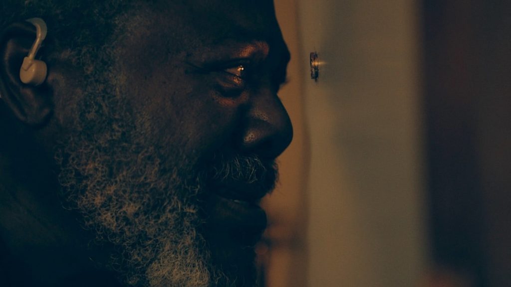 Kenneth Chamberlain peers through his spyhole