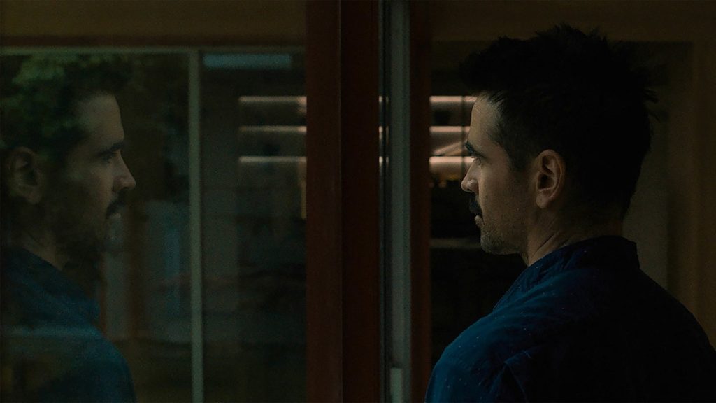 Colin Farrell in a dark room