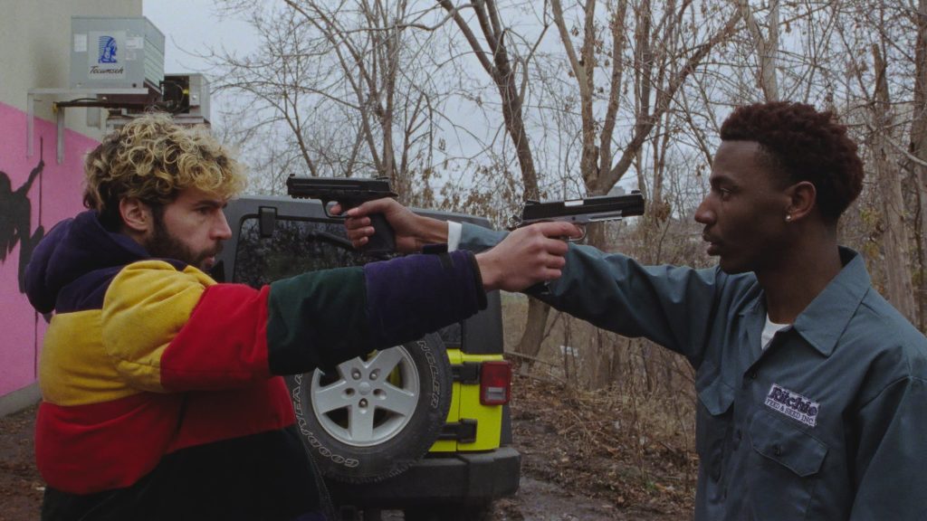 Kevin and Val point guns at each other