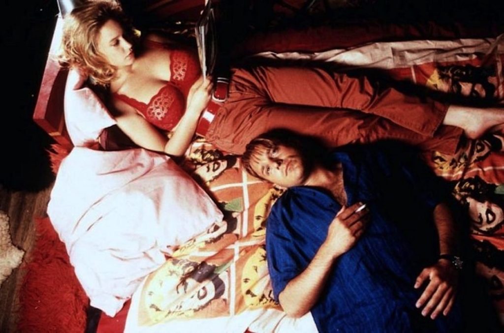 Rebecca and Marco on a bed