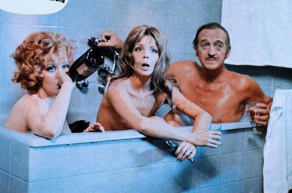 Two women in a bath with David Niven