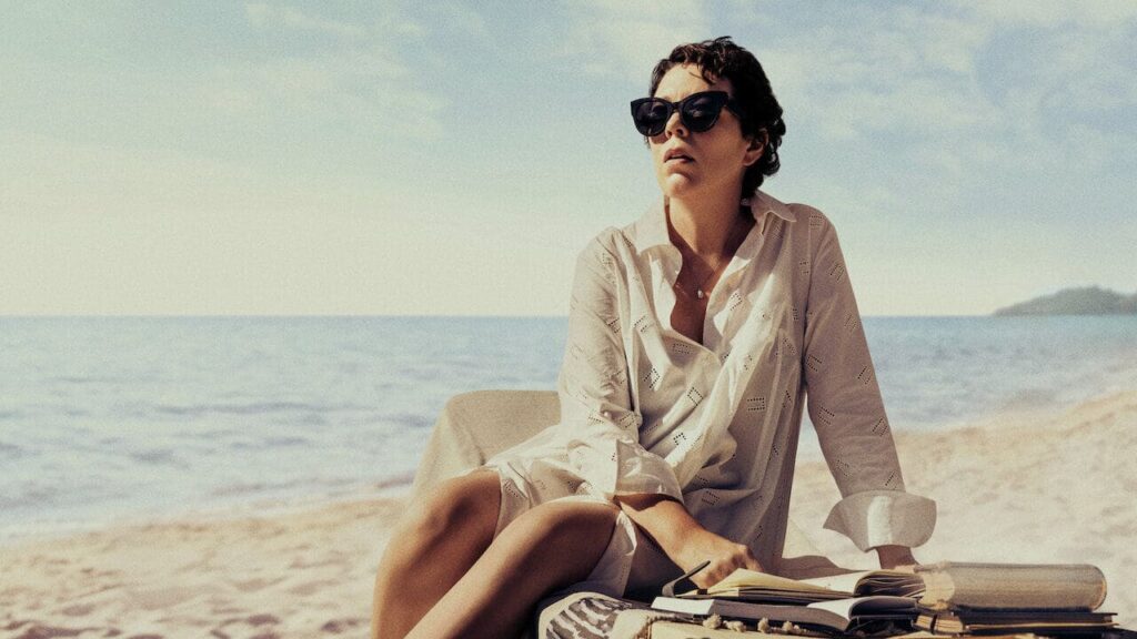 Olivia Colman in sunglasses on the beach