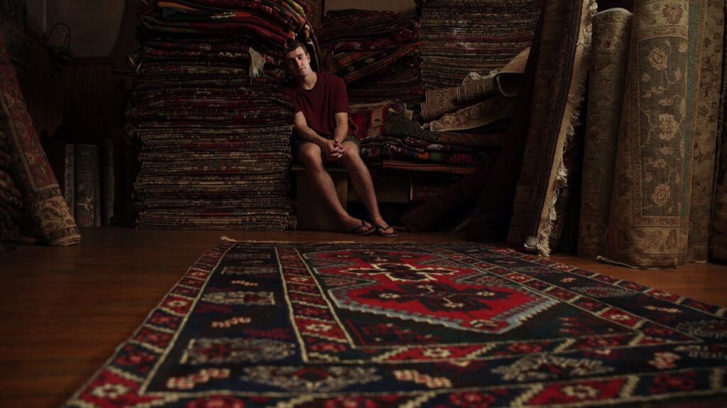 Calum alone in a Turkish carpet shop