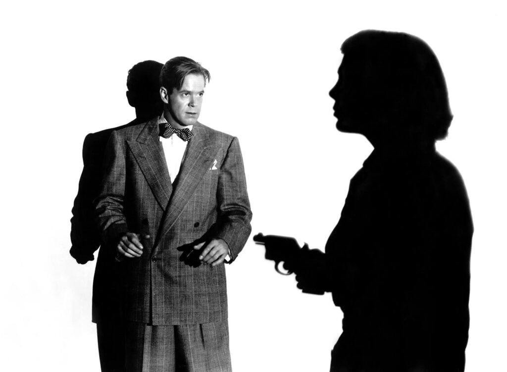Dan Duryea and the shadow of Lizabeth Scott with a gun