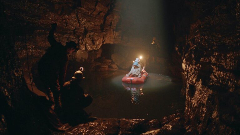 Cavers on an underground lake