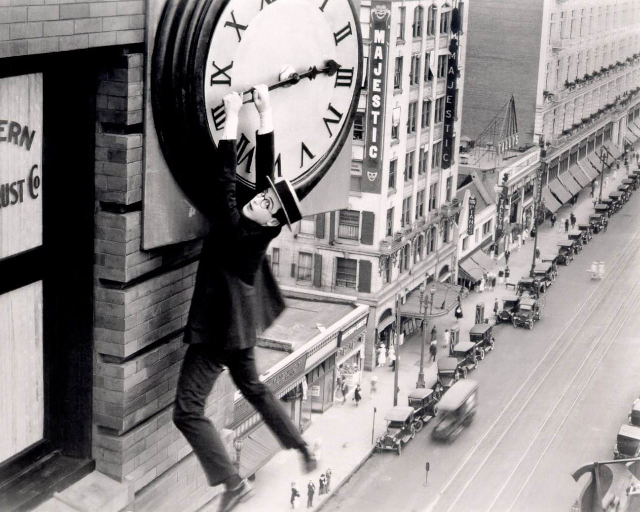 Harold hangs from the clock