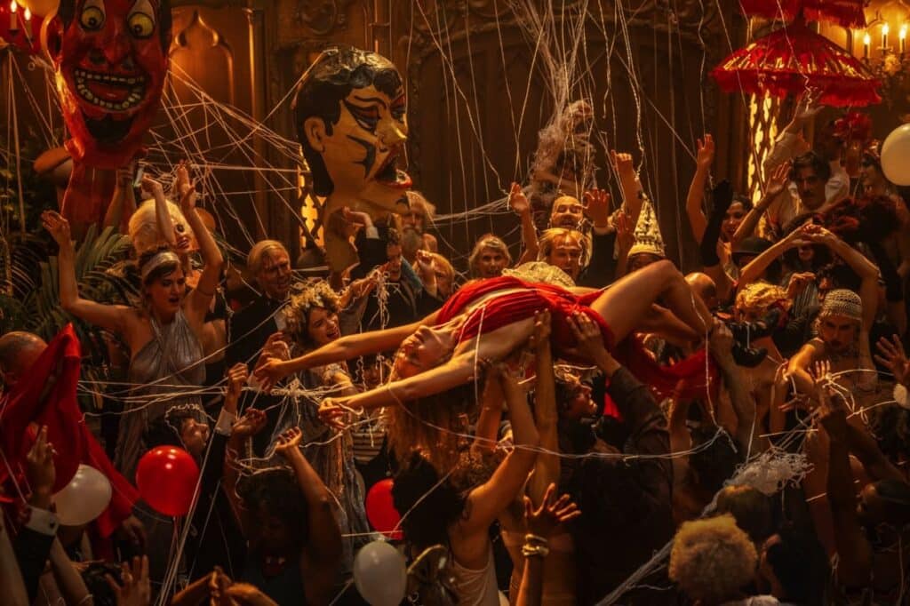 Nellie LaRoy rides the crowd at a party