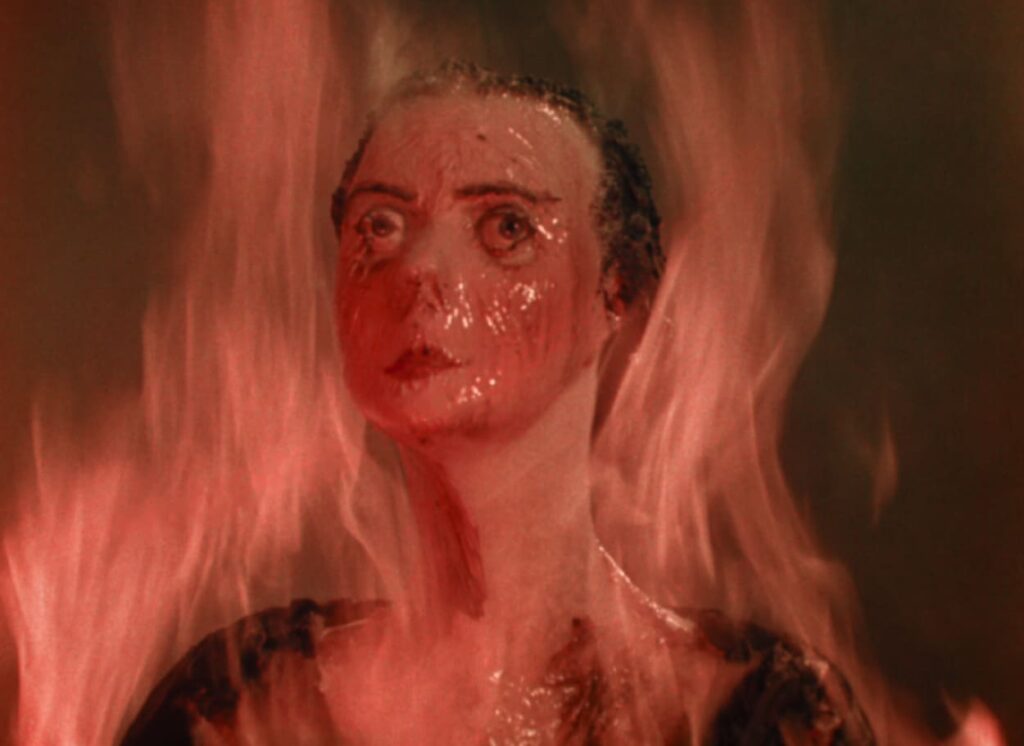 A wax figure melts in the flames
