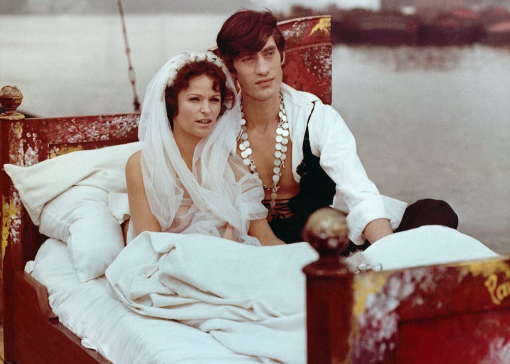 The couple float on a lake in bed