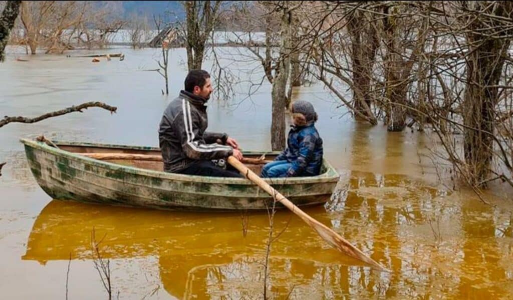 Matthias with his son in a boat