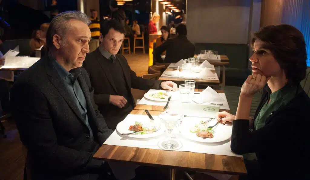 Nicolas Cage, Anton Yelchin and Irène Jacob at a restaurant table