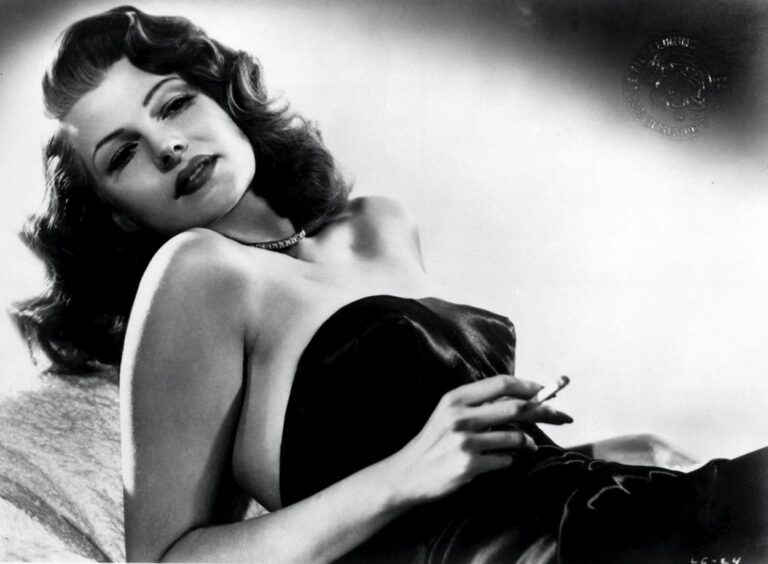 Rita Hayworth in femme fatale pose with cigarette