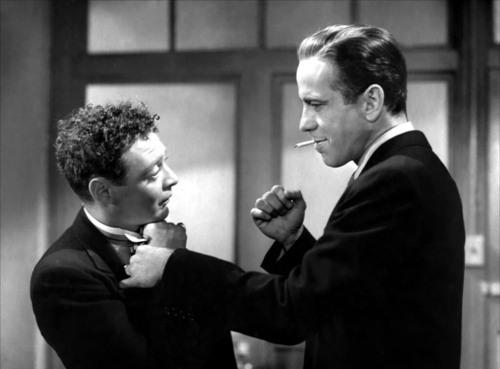 Joel Cairo is threatened by Sam Spade