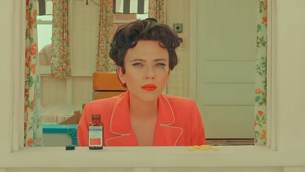 Scarlett Johansson in red top and matching lipstick